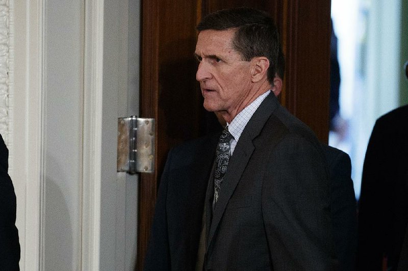 In this Feb. 13, 2017 file photo, Mike Flynn arrives for a news conference in the East Room of the White House in Washington. 