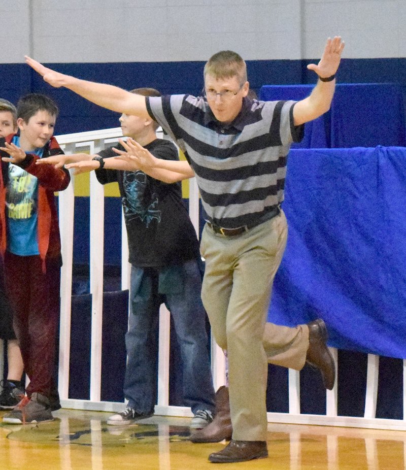 Photo by Mike Eckels John Unger (right) gets into the grove as he moves to music during the Decatur High School Dance Off at Peterson Gym in Decatur May 4.