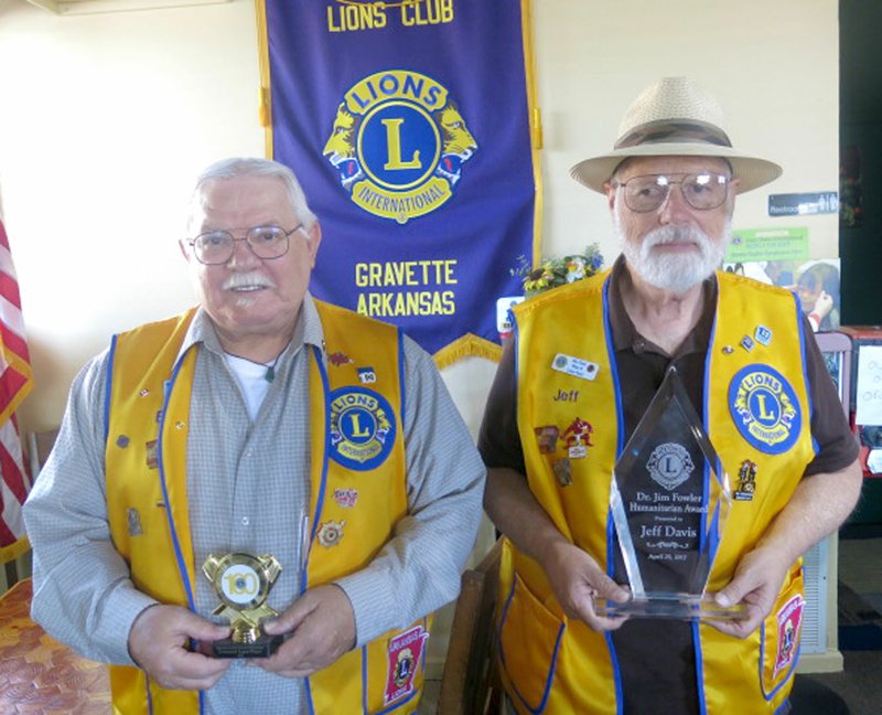 Photo by Susan Holland Bill Mattler, secretary of the Gravette Lions Club (left), and Jeff Davis, president of the club, attended the state Lions convention in Hope, Ark., April 28 and 29. At the club&#8217;s May 2 meeting they displayed awards won at the convention. Bill showed the Centennial Legacy Project award received for the club&#8217;s mural in the south part of town. Jeff Davis displayed the Dr. Jim Davis Humanitarian Award he received for his involvement in Lions Club and in civic activities.