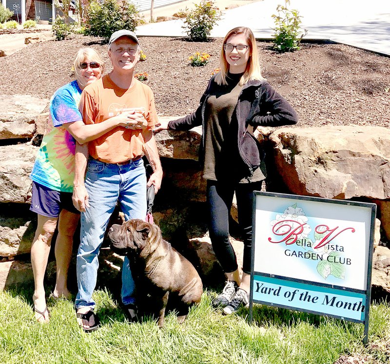 Photo submitted Jana and Kenny Fendler with their neighbor, Jody Wilson, who nominated them for the yard of the month honor.