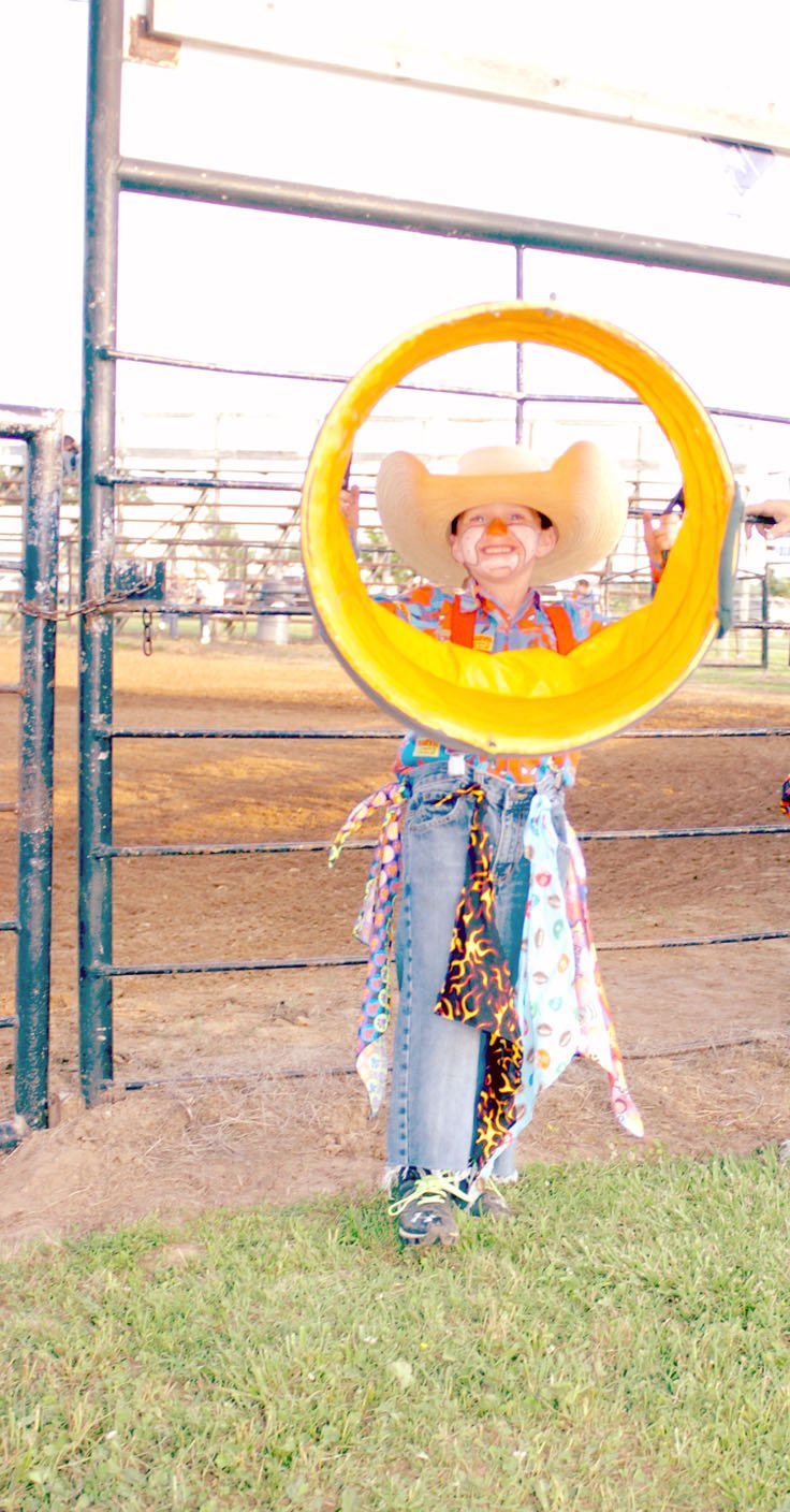 MARK HUMPHREY ENTERPRISE-LEADER Junior rodeo clown Tatum Perkins is the grandson of legendary rodeo clown, Woody Porter; and son of Charlie and Christy Perkins, of Farmington. Tatum has worked as the barrelman with his brother Tripp as sheep wrangler during past Lincoln rodeos.