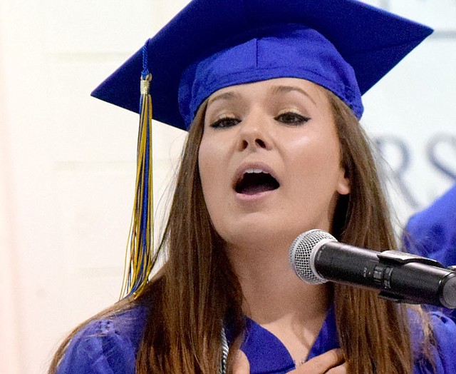 Meagan Smith led her fellow graduates, family and guests in the Pledge of Allegiance during the opening of the 2017 Decatur High School Graduation ceremony at Peterson Gym in Decatur May 14.