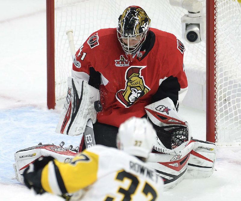 Ottawa Senators goalie Craig Anderson stops a shot by Carter Rowney of the Pittsburgh Penguins during Game 3 of the NHL Eastern Conference finals Wednesday night. Anderson had 25 saves in the Senators’ 5-1 victory.