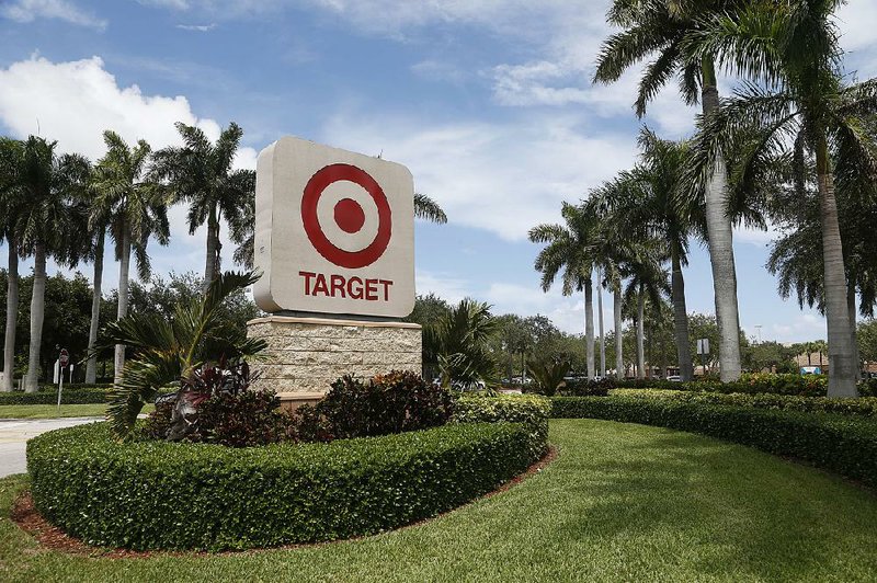 The entrance for a Target store in North Miami Beach, Fla., is seen in this Wednesday photo. Target shares closed at $55.04, up nearly 1 percent in New York trading Wednesday, but they’re still down more than 24 percent for the year. 