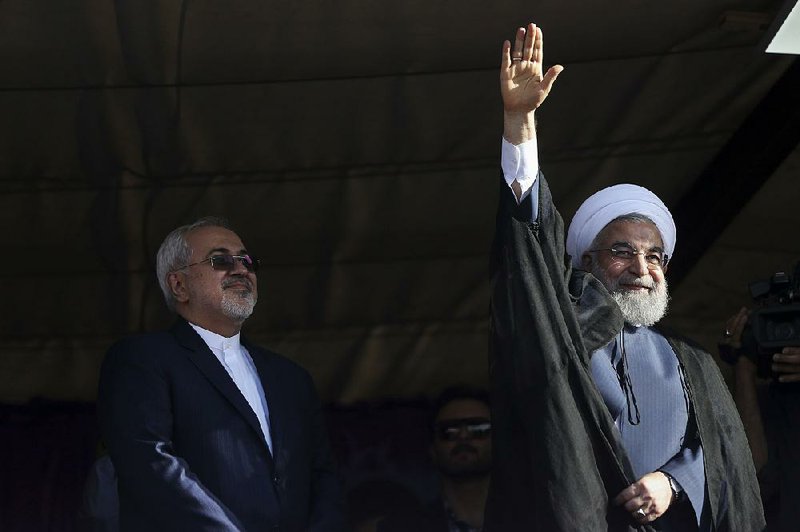 Iranian President Hassan Rouhani (right), shown at a campaign rally Sunday with Foreign Minister Mohammad Javad Zarif, was expected to benefit politically from the nuclear deal but finds himself in a re-election race.