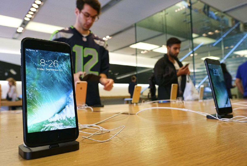 The Apple iPhone 7 is displayed at the Apple Store at the Grove in Los Angeles in September. Qualcomm Inc., the chip company, is suing manufacturers of the iPhone.
