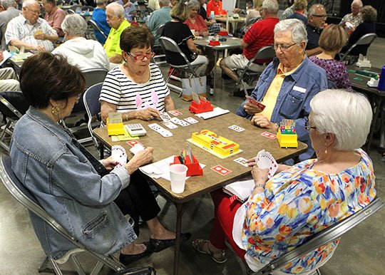 The Sentinel-Record/Richard Rasmussen DEAL THE CARDS: Joyce Franklin, left, of Little Rock, Shirley Haydel, of McComb, Miss., Art Pheifer, of Little Rock, and Dixie Miller, of Bogue Chitto, Miss., play bridge during the Resort City Regional bridge tournament Tuesday at Hot Springs Convention Center.