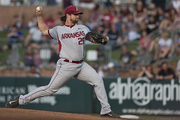 Arkansas pitcher Dominic Taccolini (25) throws in the first inning during an NCAA college baseball game against Texas A&M, Friday, May 19, 2017, in College Station, Texas. (Timothy Hurst/College Station Eagle via AP)

