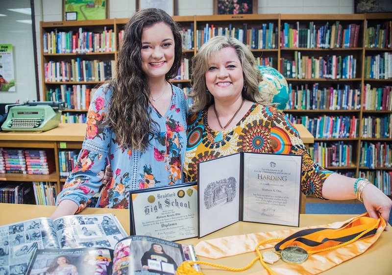 Madison Otts, left, stands with her mother, Sabrina Otts, after Madison was named the valedictorian of Bradford High School, where both her parents also graduated and Sabrina works as the school counselor.
