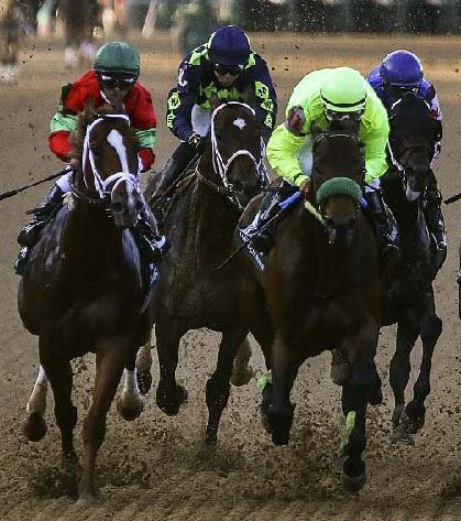 Conquest Mo Money (right), ridden by Jorge Carreno, finished second in the Arkansas Derby on April 15, but the colt might be in line for a big day in Saturday’s Preakness Stakes.