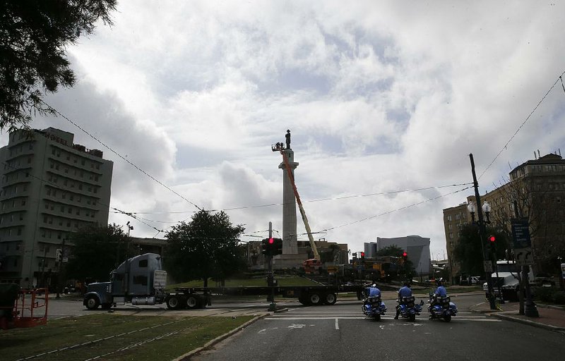Crews prepare to take down the statue of Confederate Gen. Robert E. Lee in Lee Circle on Friday in New Orleans. 