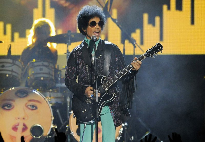 In this May 19, 2013, file photo, Prince performs at the Billboard Music Awards at the MGM Grand Garden Arena in Las Vegas. 