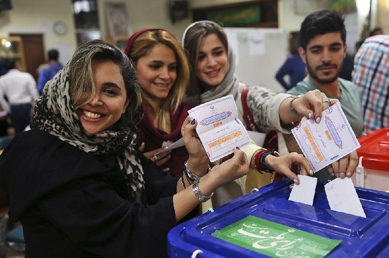 Iranians cast their ballots in the presidential election Friday at a polling station in Tehran. 