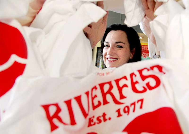 Catherine Cole, Riverfest chairman for 2017, keeps her head in the game in planning not only the annual festival but its 40th anniversary celebration. 