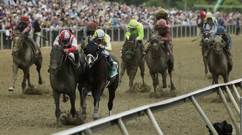 Cloud Computing (second from left), with Javier Castellano in the irons, overtook Classic Empire (second from right) in the deep stretch to win the Preakness Stakes at Pimlico Race Course on Saturday. Senior Investment (far left) got up for third.
