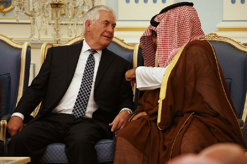 Secretary of State Rex Tillerson talks with Saudi Crown Prince and Defense Minister Mohammed bin Salman on Saturday in Riyadh. U.S. and Saudi officials reached agreement on a $110 billion arms deal. 