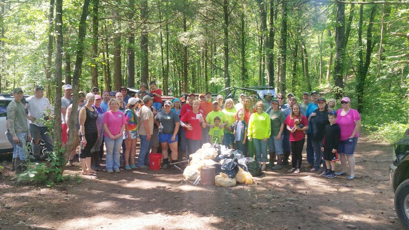 Photo submitted Members of nine ATV riding groups recently took to the woods to clean up litter from the Buckhorn Off Highway Vehicle trail system in northern Crawford County and had a food drive for 7 Hills Homeless Shelter in Fayetteville. After the trails were cleaned, a benefit hot dog roast was held and drawings for prizes were held for participation.