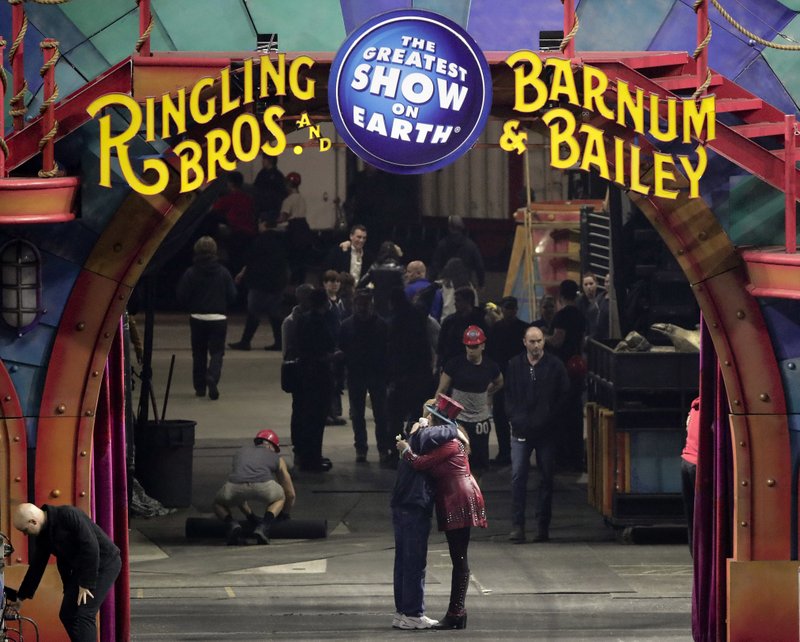 Ringmaster Kristen Michelle Wilson, right, hugs a member of the crew after the red unit's final performance, Sunday, May 7, 2017, in Providence, R.I. For the performers who travel with the Ringling Bros. and Barnum & Bailey Circus, its demise means the end of a unique way of life for hundreds of performers and crew members.