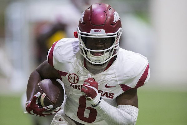T.J. Hammonds runs after a catch during Arkansas' football practice on Saturday, April 29, 2017, inside Walker Pavilion in Fayetteville. T.J. Hammonds runs after a catch during Arkansas' football practice on Saturday, April 29, 2017, inside Walker Pavilion in Fayetteville.
