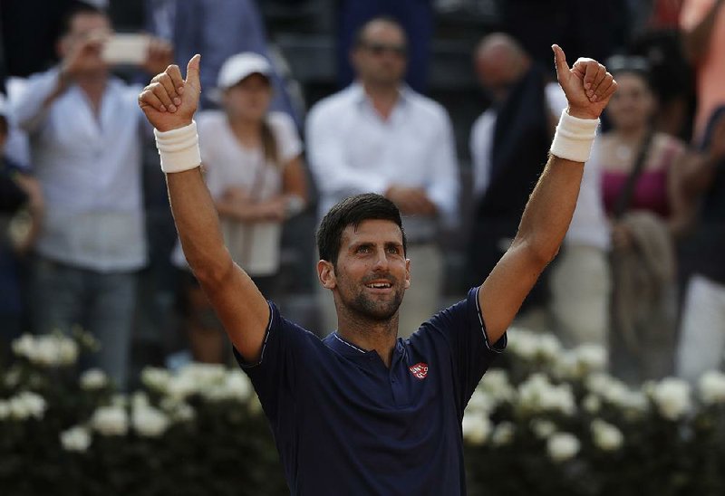 Serbia's Novak Djokovic celebrates after beating Spain's Roberto Bautista Agut at the Italian Open tennis tournament, in Rome, Thursday, May 18, 2017. 
