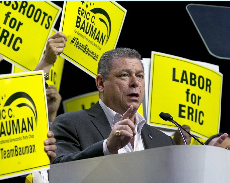 FILE - In this Saturday, May 20, 2017 file photo, Eric Bauman addresses the California Democratic Party annual convention as he seeks their vote for chairman in Sacramento, Calif. 