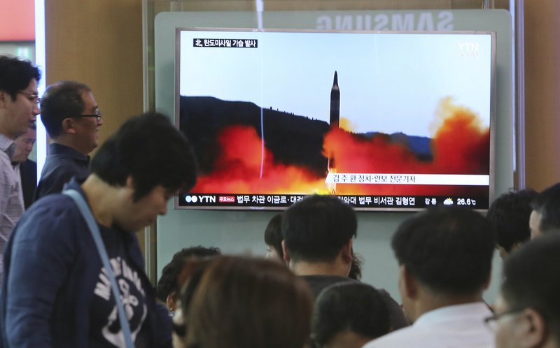 People watch a TV news program showing a file image of a missile launch by North Korea, at the Seoul Railway Station in Seoul, South Korea, Sunday, May 21, 2017. North Korea on Sunday fired a midrange ballistic missile, U.S. and South Korean officials said, in the latest weapons test for a country speeding up its development of nuclear weapons and missiles. 