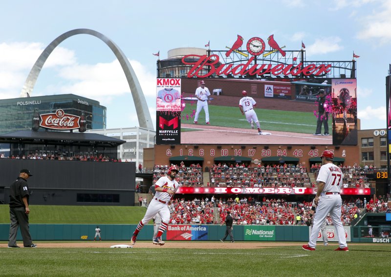 The Associated Press ROUNDING THIRD: St. Louis Cardinals' Matt Carpenter (13) rounds the bases after hitting a two-run home run as third base coach Chris Maloney (77) watches during the fifth inning of a baseball game against the San Francisco Giants Sunday in St. Louis.