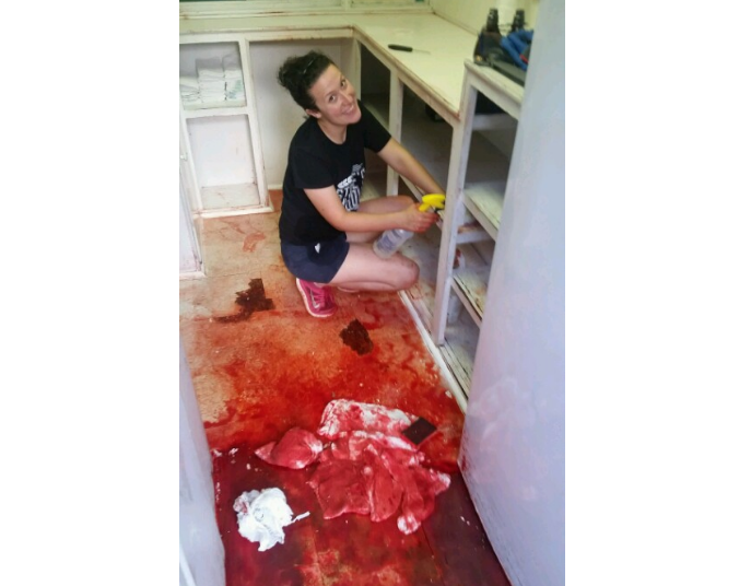 The inside of Cajun Sno, a Little Rock snow cone shop, that was vandalized after an unknown person spilled a gallon of red syrup over the floor and fridge.