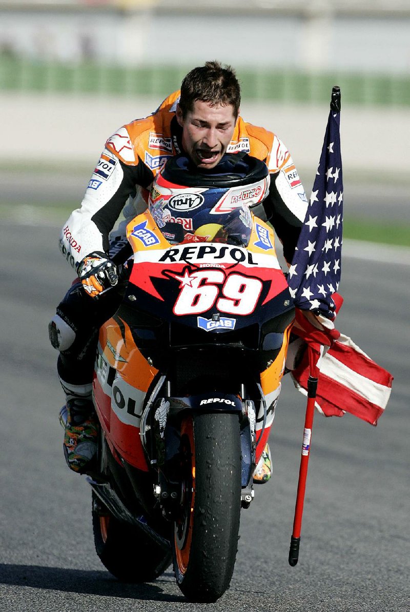 American Nicky Hayden, shown after winning the world MotoGP title in 2006, died Monday from injuries suffered
when the bicycle he was riding was struck by a car along the Rimini coast in Italy on Wednesday. He was 35.