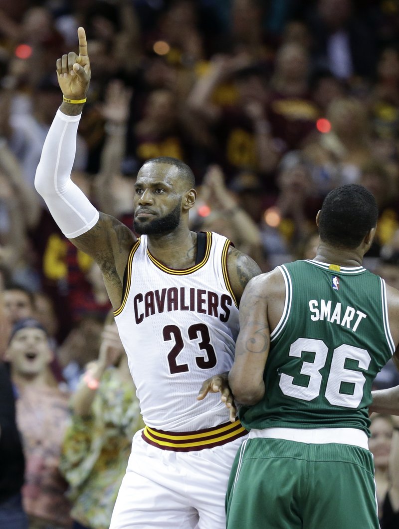 Cleveland Cavaliers' LeBron James (23) celebrates against Boston Celtics' Marcus Smart (36) during the first half of Game 3 of the NBA basketball Eastern Conference finals, Sunday, May 21, 2017, in Cleveland. 