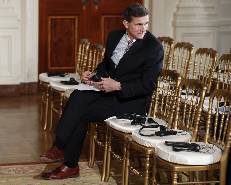 In this photo taken Feb. 10, 2017, then-National Security Adviser Michael Flynn sits in the front row in the East Room of the White House, in Washington.