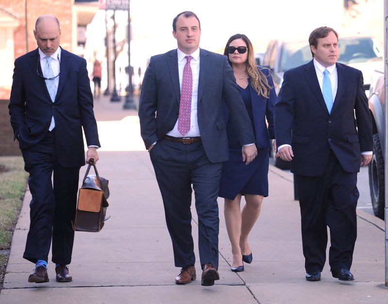 NWA Democrat-Gazette/ANDY SHUPE
Former state Sen. Jon Woods (right) walks with his attorney Patrick Benca (far left) and others from the Benca Law Firm to the John Paul Hammerschmidt Federal Building Tuesday, March 28, 2017, in Fayetteville. 

***JOHN KENNEDY (CENTER) identified by Doug Thompson***