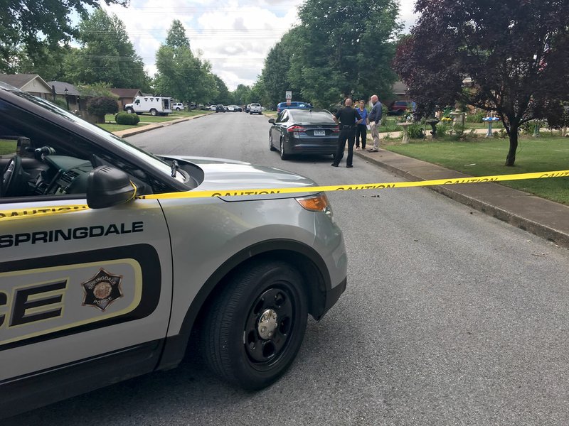 NWA Democrat-Gazette/FLIP PUTTHOFF Springdale police cordon off the 800 block of Gwen Street Tuesday, May 23, 2017 in Springdale. Police were investigating a suspicious vehicle outside of a vacant home on the block.