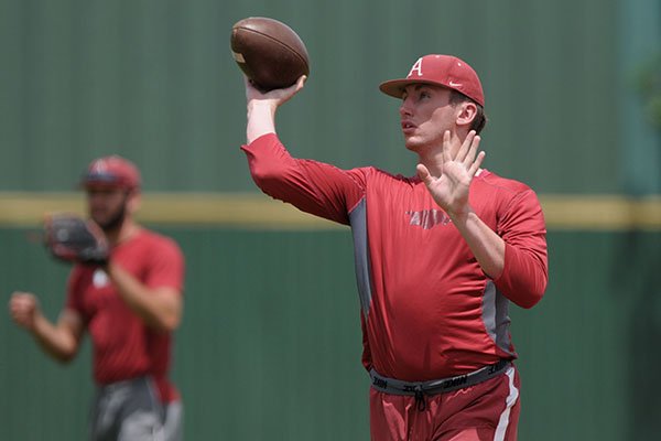 Trevor Stephan, Arkansas right hand pitcher, warms up with a football Tuesday, May 23, 2017, during practice at Jerry D. Young Memorial Field on the campus of UAB in Birmingham, Ala.
