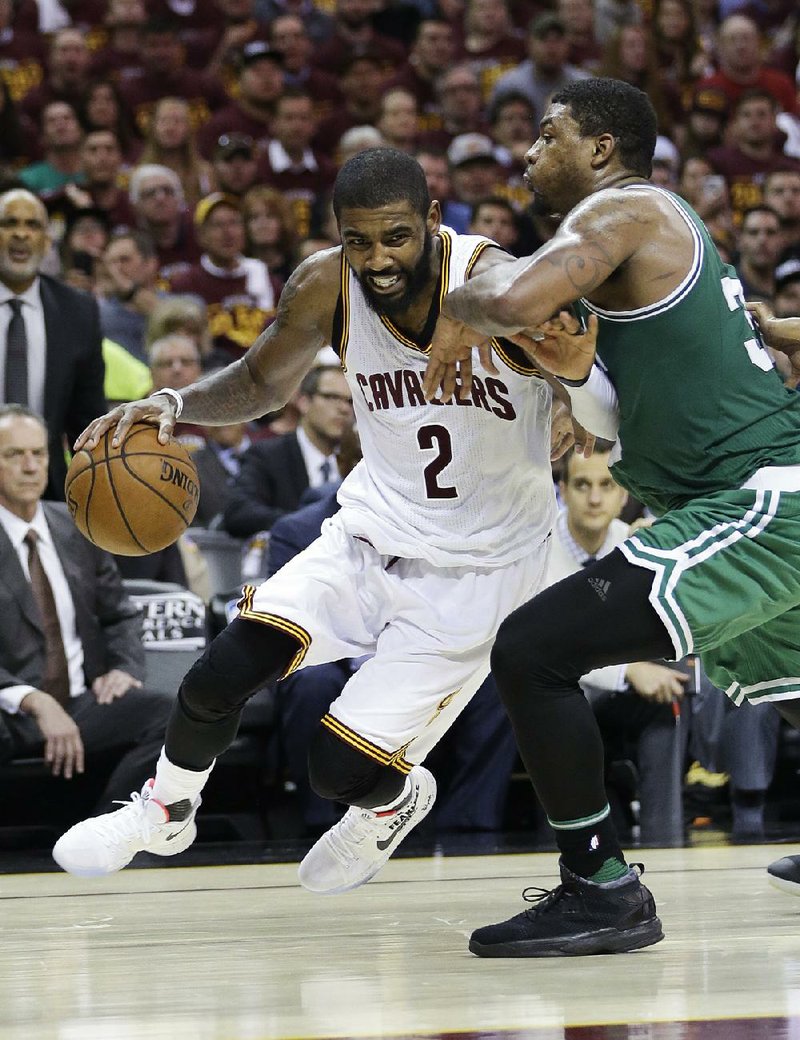 Cleveland guard Kyrie Irving tries to get past Boston defender Marcus Smart during Game 4 of the NBA Eastern Conference finals Tuesday night. Irving scored 21 of his game-high 42 points in the third quarter to power the Cavaliers to a 112-99 victory.