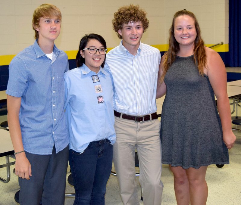 Photo by Mike Eckels While family and friends snapped last minute photos, honor graduates posed together during the 2017 Decatur Chamber of Commerce&#8217;s annual honors banquet in the cafeteria at Decatur High School May 8. Those being honored for their academic excellence included Bracy Owens (left), Shaney Lee, Ryan Shaffer and Cameron Shaffer.