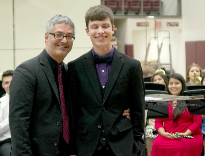 Photo submitted Band director Daniel Hodge posed with Sam Youmans during the band concert on May 9. Youmans composed a song and directed the high school concert band as they played it.