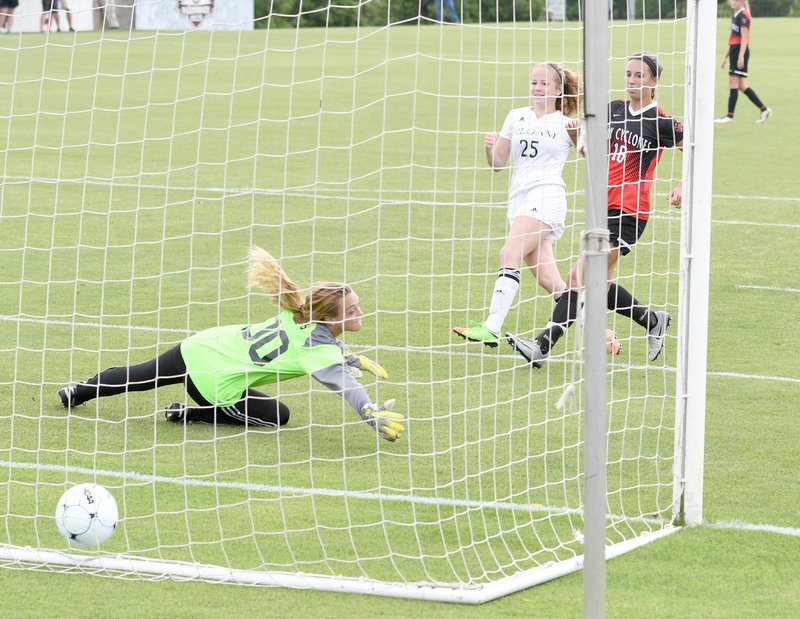 Bud Sullins/Special to the Herald-Leader Siloam Springs junior Megan Hutto, No. 25, watches as her shot goes past Russellville keeper Brit Hillis during Friday&#8217;s Class 6A state championship game.