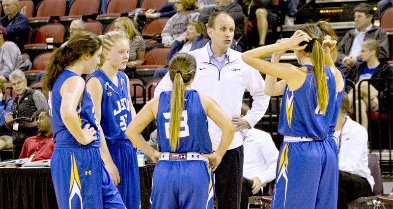 Photo courtesy of JBU Sports Information John Brown head women&#8217;s basketball coach Jeff Soderquist gives instructions to his team during a game in the 2016-17 season.