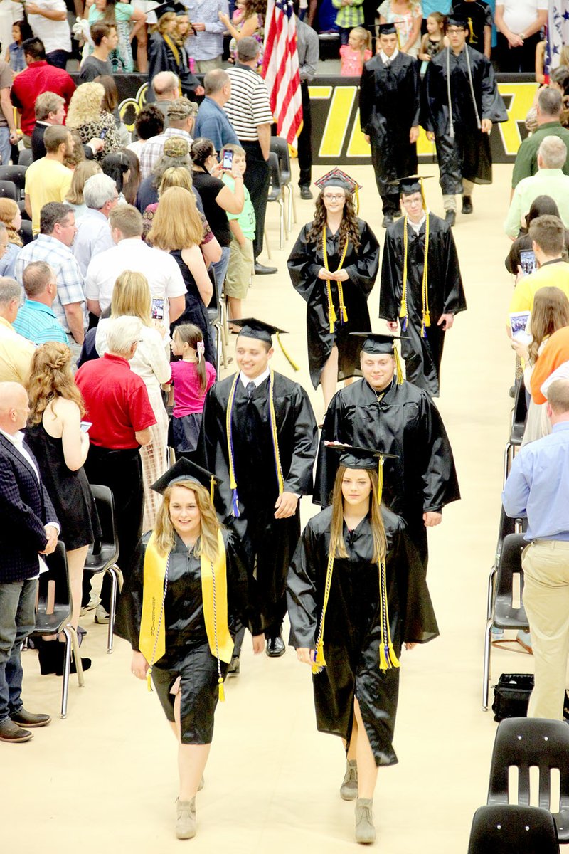 Prairie Grove High School Class of 2017 files into place, walking two-by-two. This year&#8217;s class had 138 graduates.