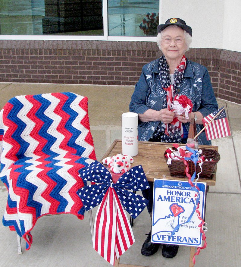 Photo submitted Laurine Barnett, 93, has been passing out red poppies for the American Legion Auxiliary before Memorial Day since 1977. Her favorite location for handing out the crepe paper flowers is at the Siloam Springs Post Office. She will be there passing out red poppies this Saturday from 9 a.m. to noon.
