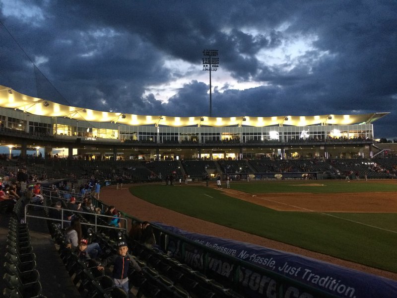 Players and fans wait Tuesday, May 23, 2017, after the stadium lights shut off during the Northwest Arkansas Naturals' game with Frisco during the fifth inning at Arvest Ballpark. Visit nwadg.com/photos to see more photographs from the game.