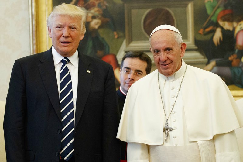 U.S. President Donald Trump stands with Pope Francis during a meeting Wednesday, May 24, 2017, at the Vatican. 
