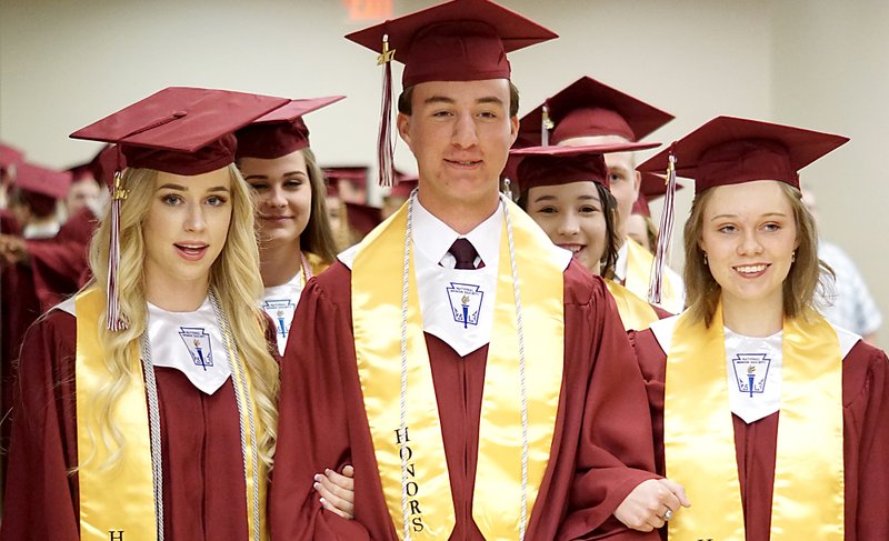 Led by Amber Ellis, Derek German and Jessica Sykes, Gentry seniors were ready to march in at graduation ceremonies at Bill George Arena in Siloam Springs on Sunday.