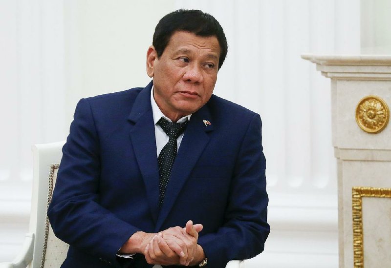 Philippine President Rodrigo Duterte listens to Russian President Vladimir Putin during their meeting at the Kremlin in Moscow, Russia, Tuesday, May 23, 2017. 