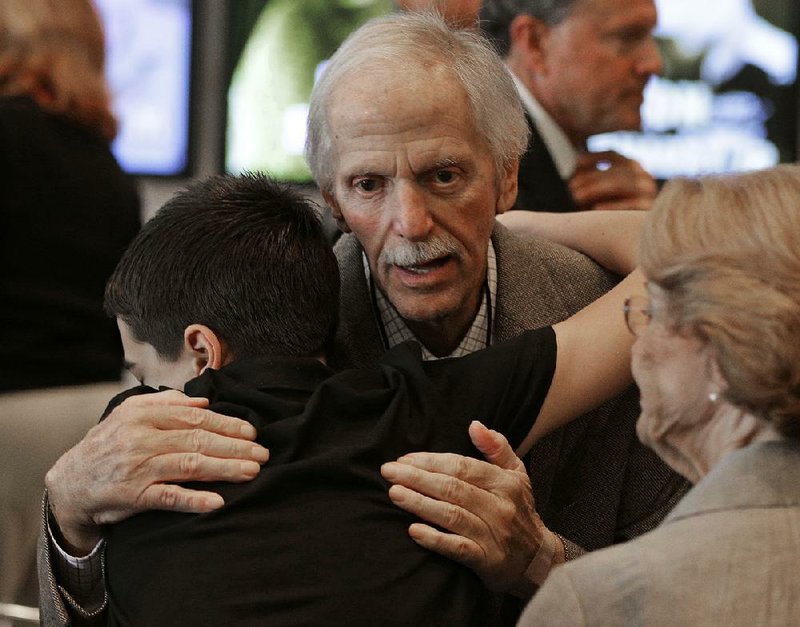 Former team owner Robert Yates is congratulated by a family member after being named as a member of the class of 2018 during an announcement at the NASCAR Hall of Fame in Charlotte, N.C., Wednesday, May 24, 2017. 