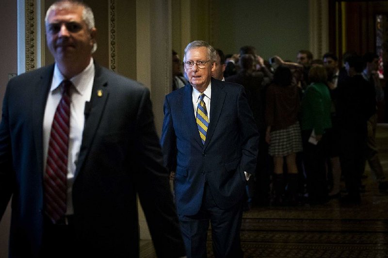 Senate Majority Leader Mitch McConnell (center) repeated Wednesday the Senate’s intent to make changes to the House bill to repeal and replace the health care law but said he wasn’t sure it would get enough votes to pass. 


