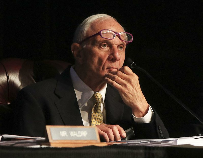 David Pryor, a member of the University of Arkansas board of trustees, listens to a report on tuition and fees during a meeting on the University of Arkansas at Little Rock campus on Wednesday. Pryor is a member of the board’s Academic and Student Affairs Committee. 
