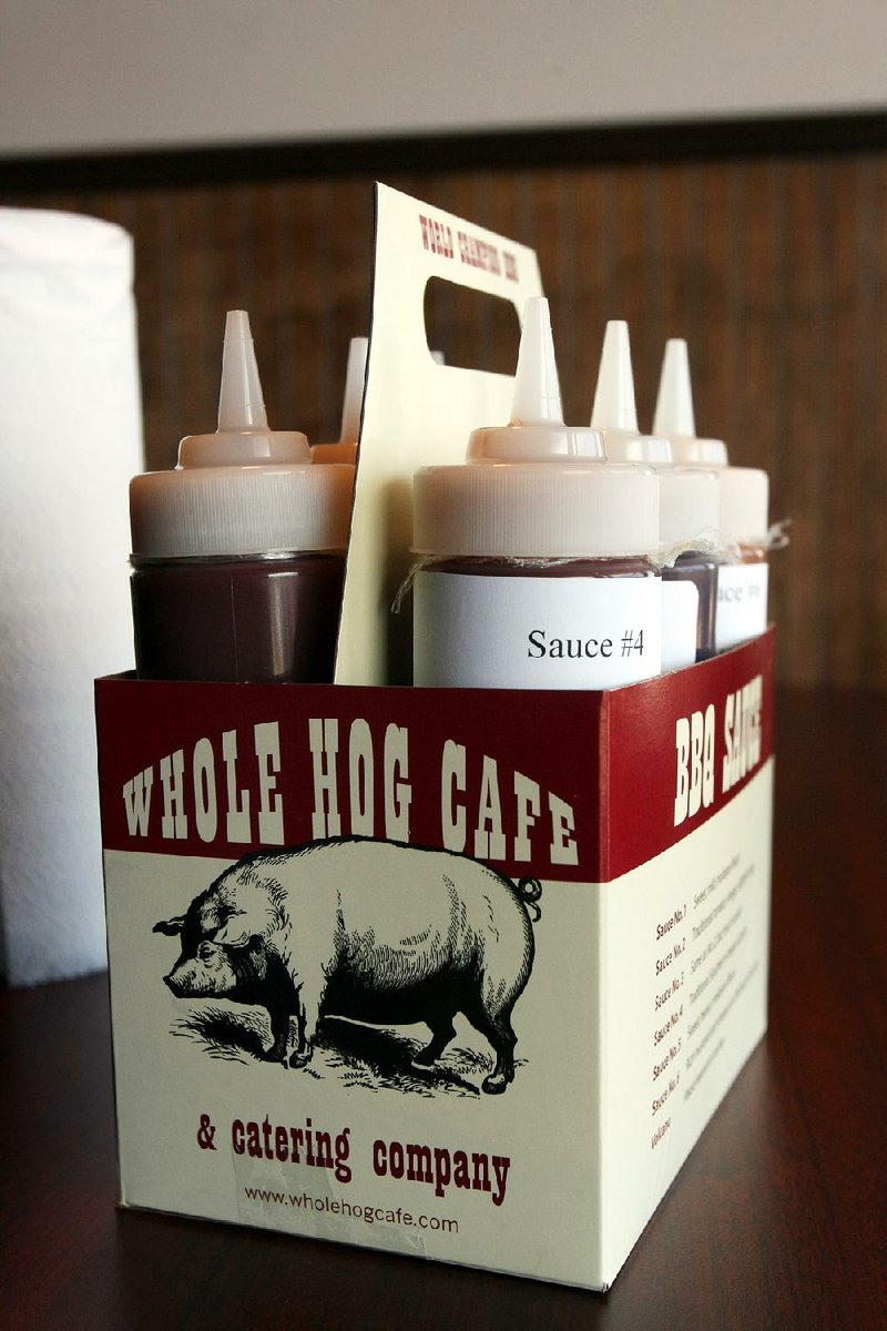 Whole Hog offers customers a choice of six barbecue sauces on its tables. 