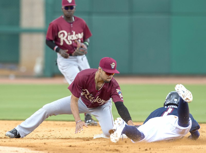 Northwest Arkansas' Jack Lopez (right) is tagged out by Frisco second baseman Isiah Kiner-Falefa on Wednesday at Arvest Ballpark in Springdale.